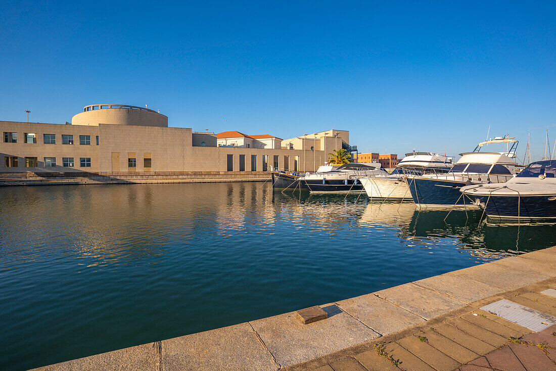 View of Archaeological Museum of Olbia and harbour boats on sunny day on Olbia, Olbia, Sardinia, Italy, Mediterranean, Europe