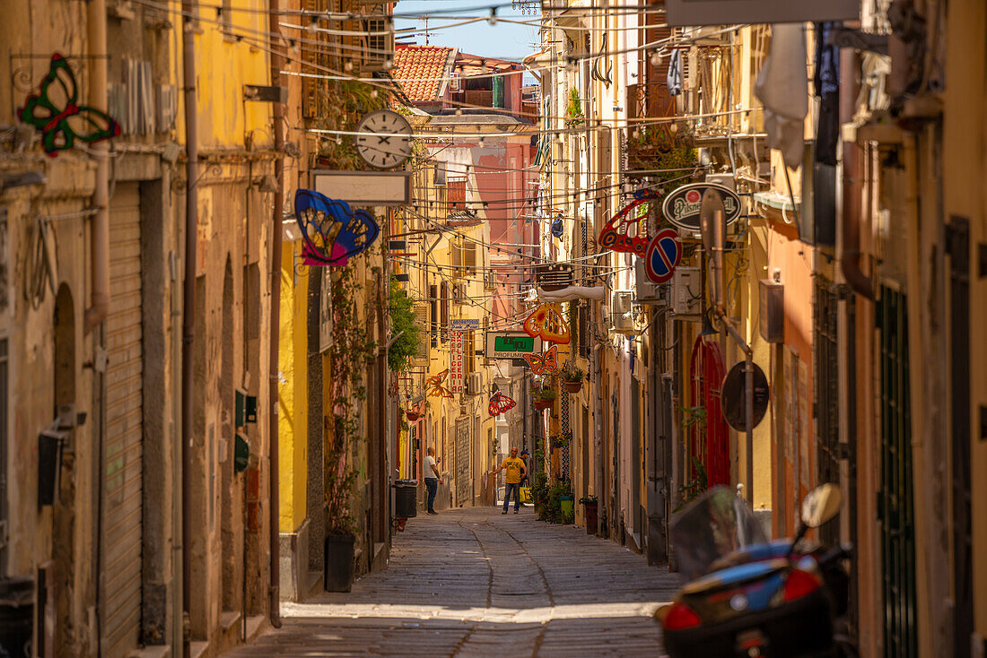 View of narrow street lined with rustic buildings in Sassari, Sassari, Sardinia, Italy, Mediterranean, Europe