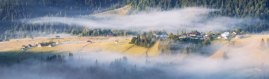 Ukraine, Ivano Frankivsk region, Verkhovyna district, Dzembronya village, Panoramic view of rolling landscape in Carpathian Mountains