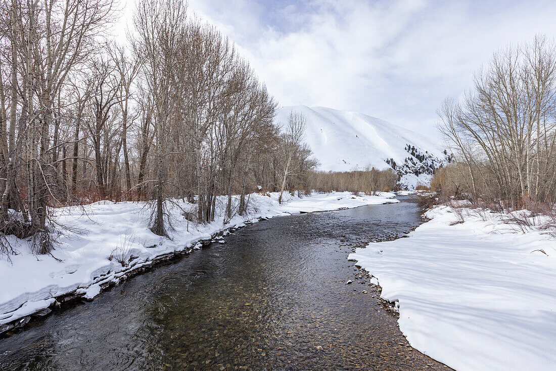 USA, Idaho, Bellevue, River flowing in mountains in winter