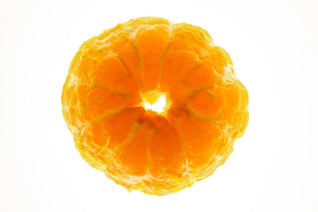 Peeled orange on white background 