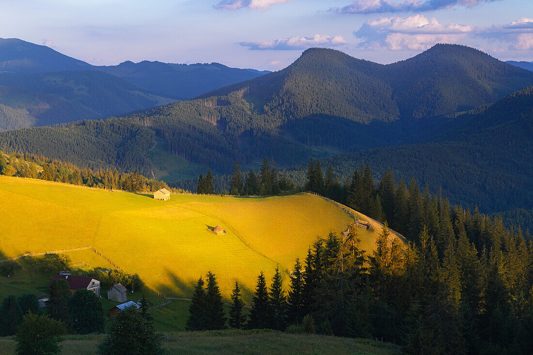 Ukraine, Ivano Frankivsk region, Verkhovyna district, Dzembronya village, Rural area in Carpathian Mountains at sunset