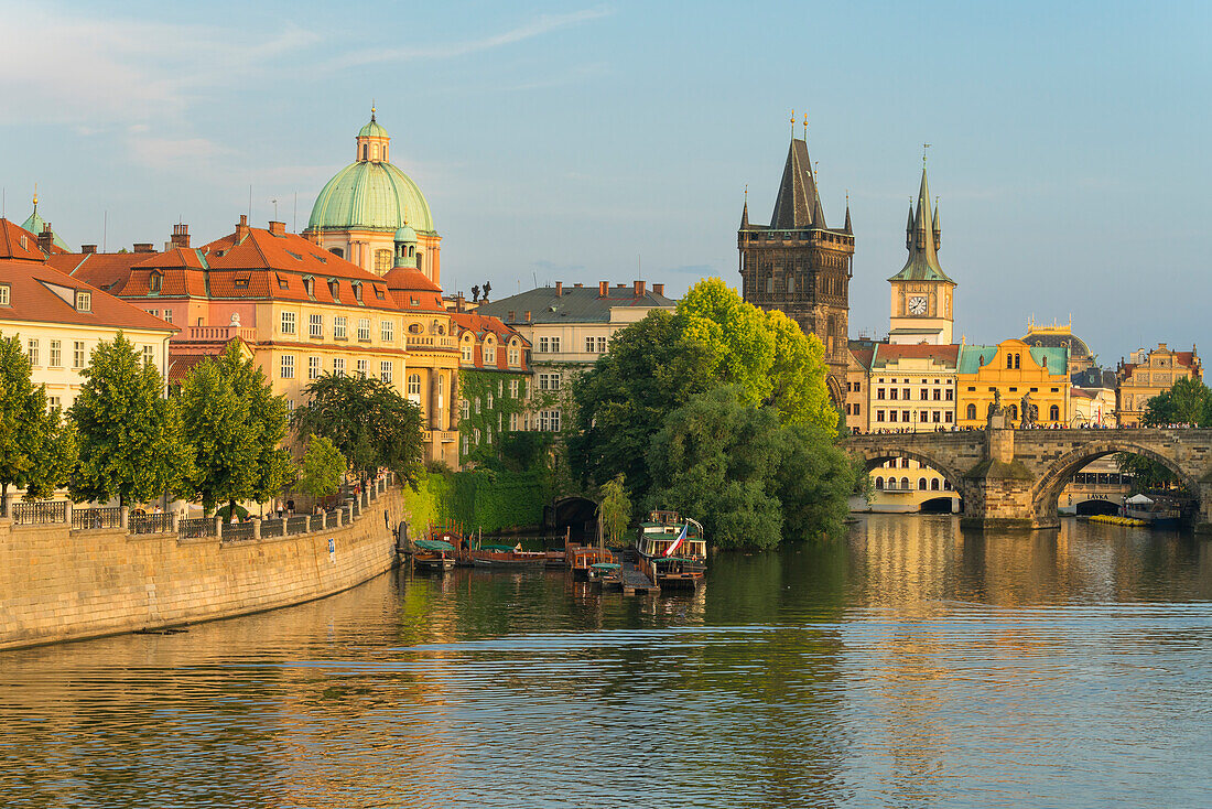 Charles Bridge and Church of Saint Francis of Assisi with Old Town Bridge Tower against sky, UNESCO World Heritage Site, Prague, Bohemia, Czech Republic (Czechia), Europe