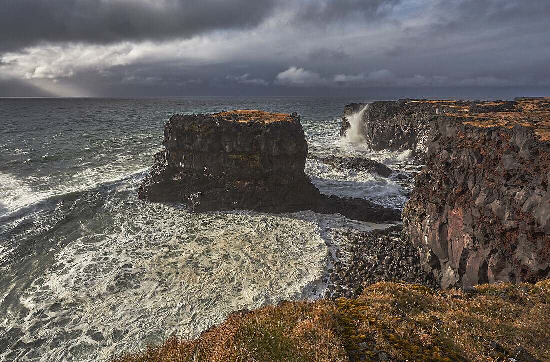 Storm surf against lava cliffs at Skalasnagi, in Snaefellsjokull National Park, the northwestern tip of the Snaefellsnes peninsula, on the west coast of Iceland, Polar Regions