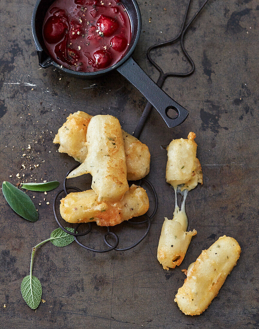 Gruyère-Beignets mit Pfeffer-Kirsch-Dip (Schweiz)