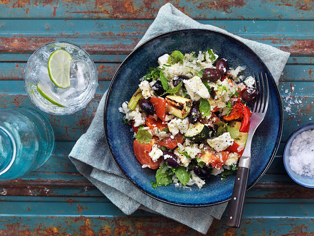 Tabbouleh with cauliflower, tomato, mint, feta, olives, and red pepper