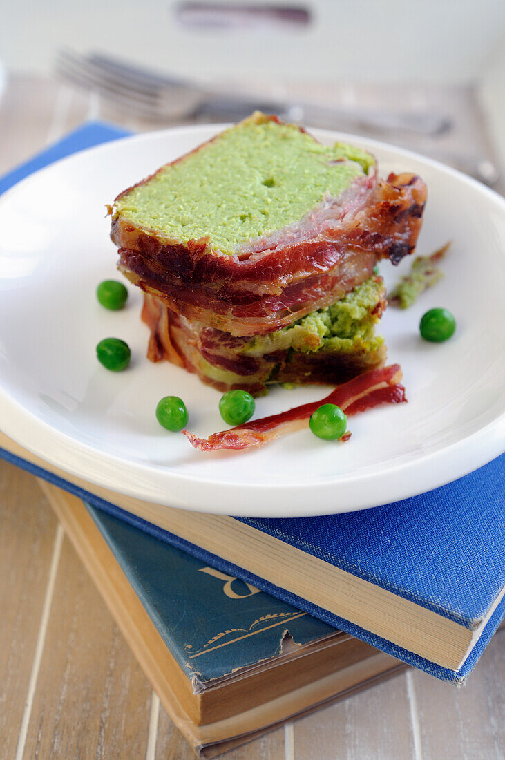 Pea mousse loaf in crispy bacon coating baked in the oven