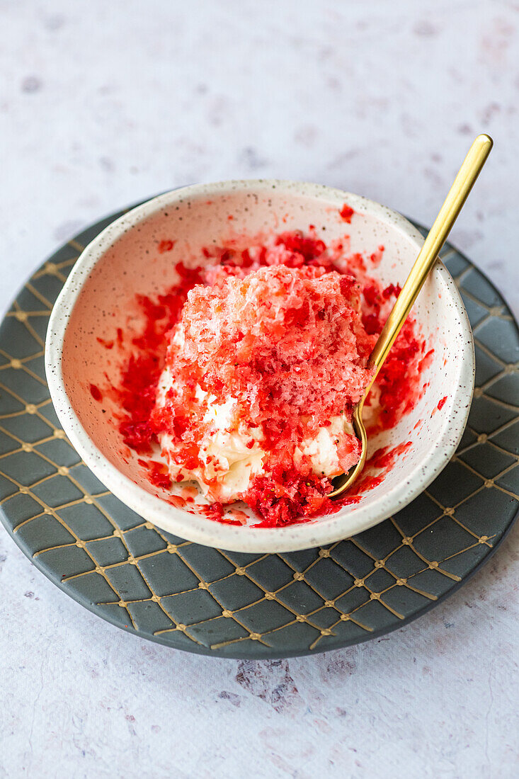 Grated frozen clementine on whipped cream