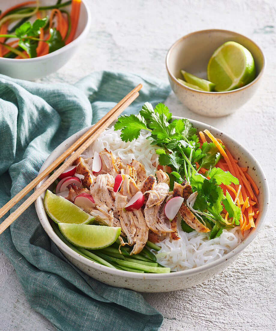 Asian noodle bowl with chicken and vegetables