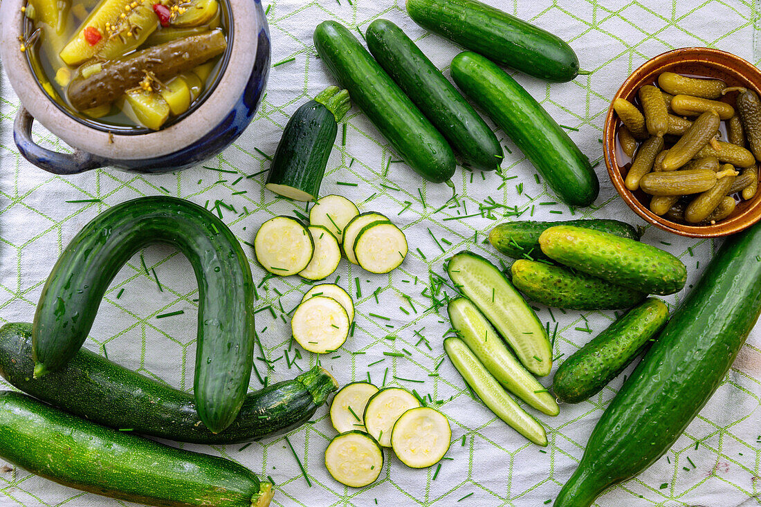 Different types of cucumbers, fresh and pickled