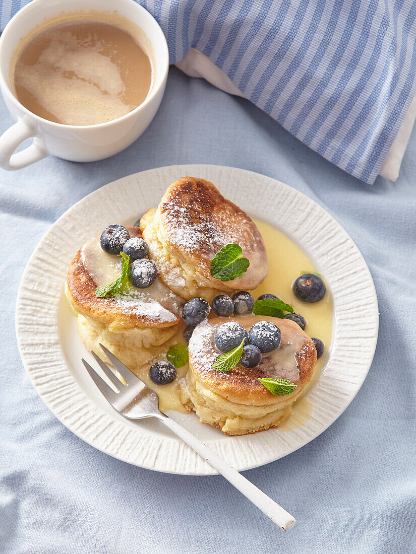 Japanese pancakes with blueberries and vanilla sauce
