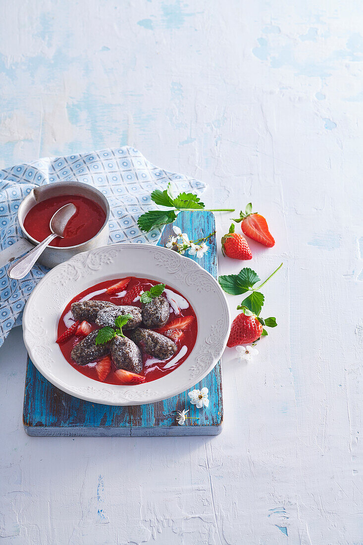 Sweet poppy seed gnocchi with strawberry sauce