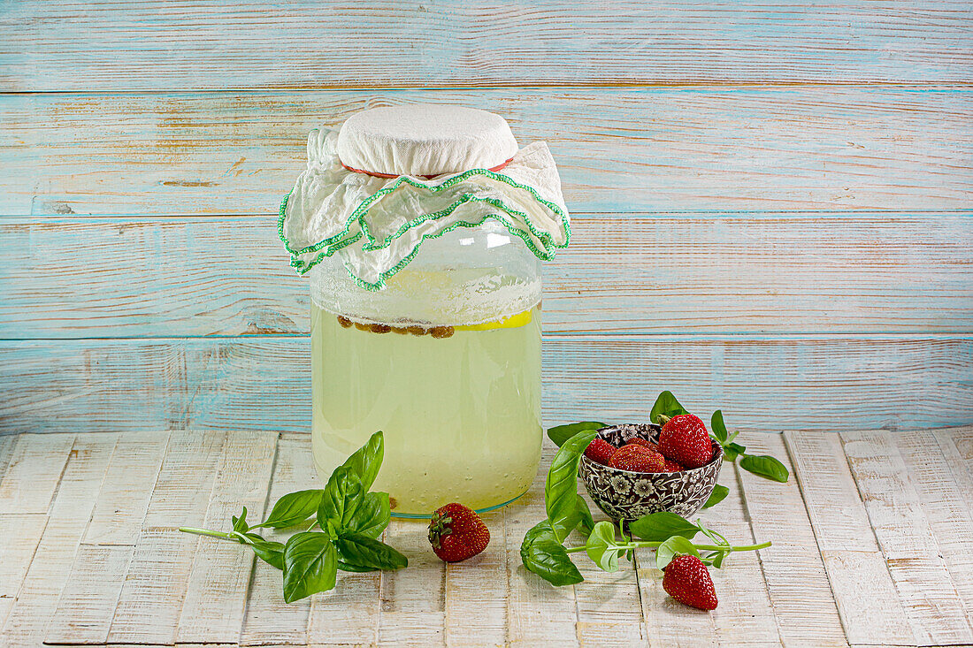 Water kefir with strawberries and basil