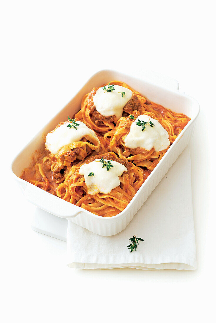 Tagliatelle with meat sauce and baked provola