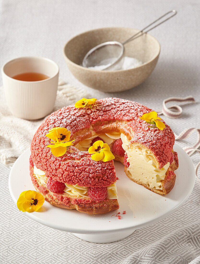 Large cream puff with raspberries