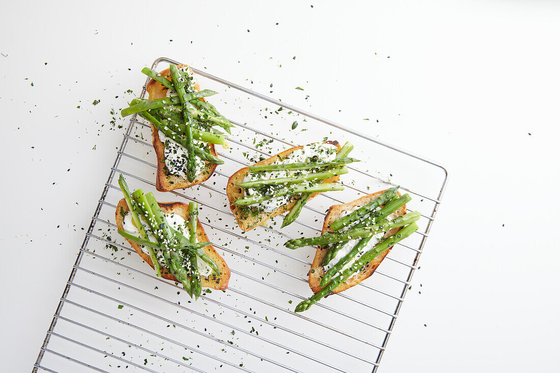 Bruschetta with asparagus, goat cheese, and sesame seeds