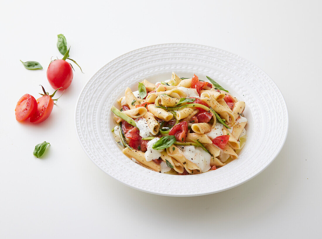 Cold garganelli with marinated zucchini and tomatoes