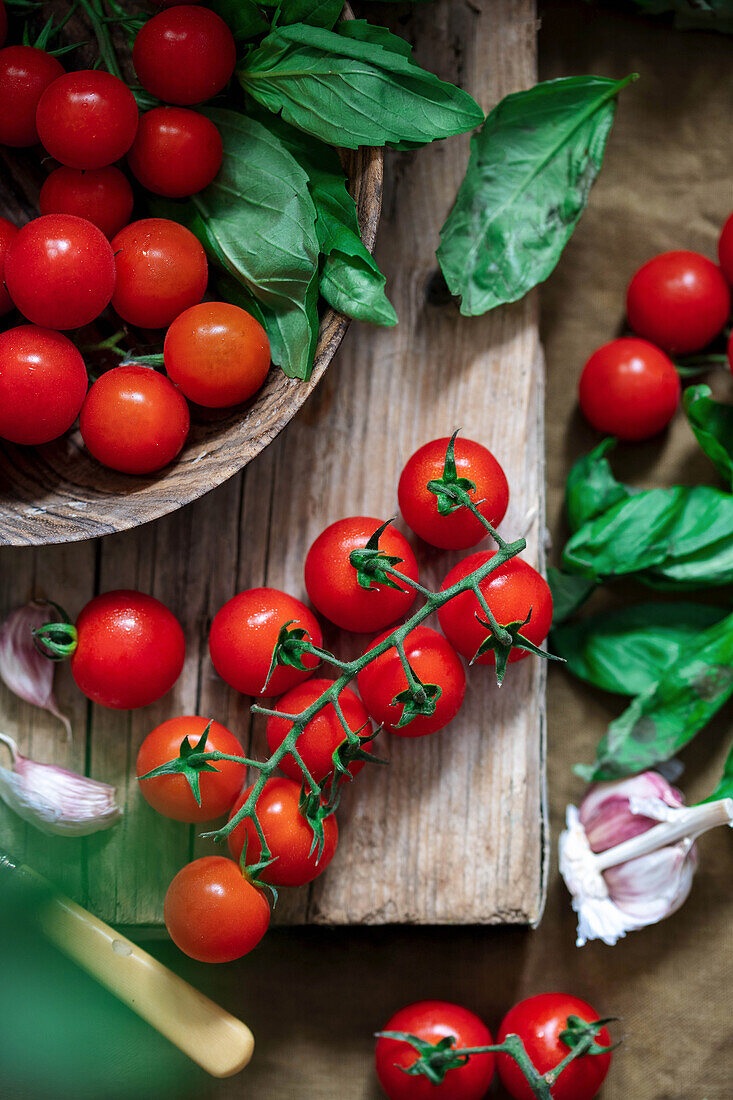 Fresh cherry tomatoes and basil leaves