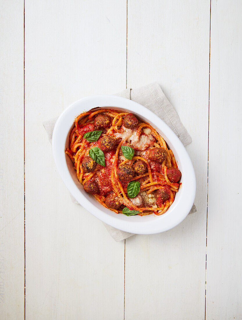 Scalloped bucatini with tomato sauce and meatballs