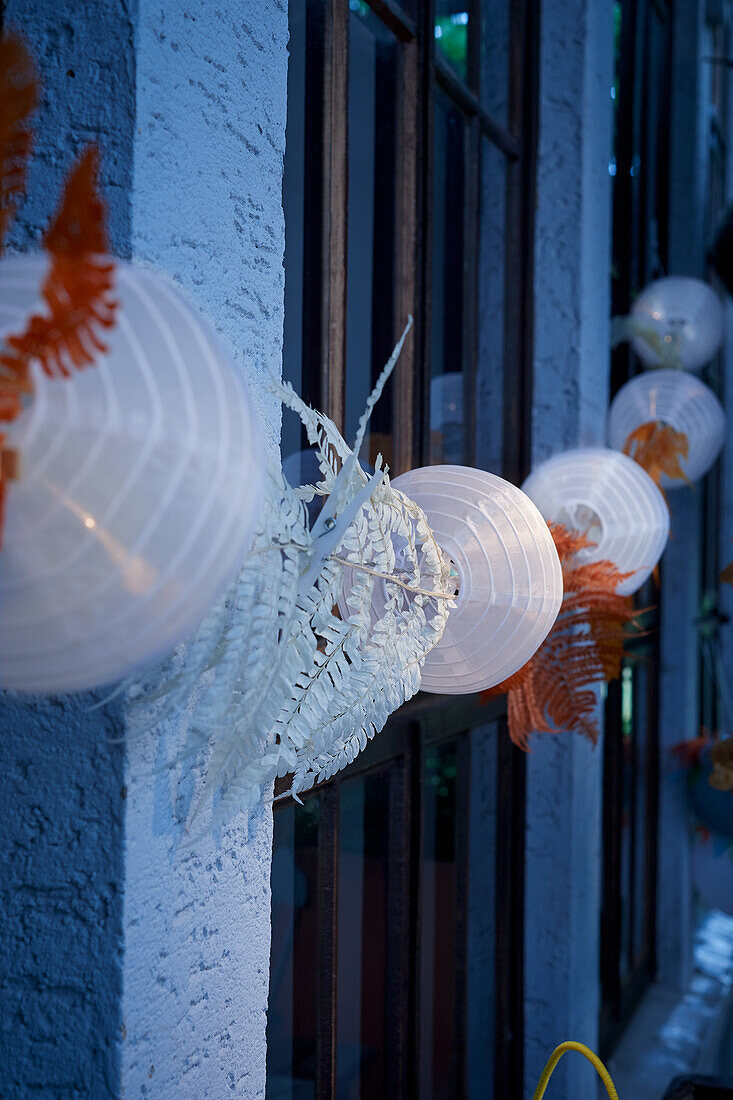 DIY light garlands on house wall