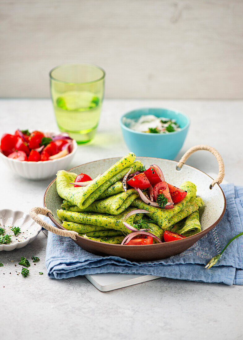 Wild garlic pancakes with tomato salad