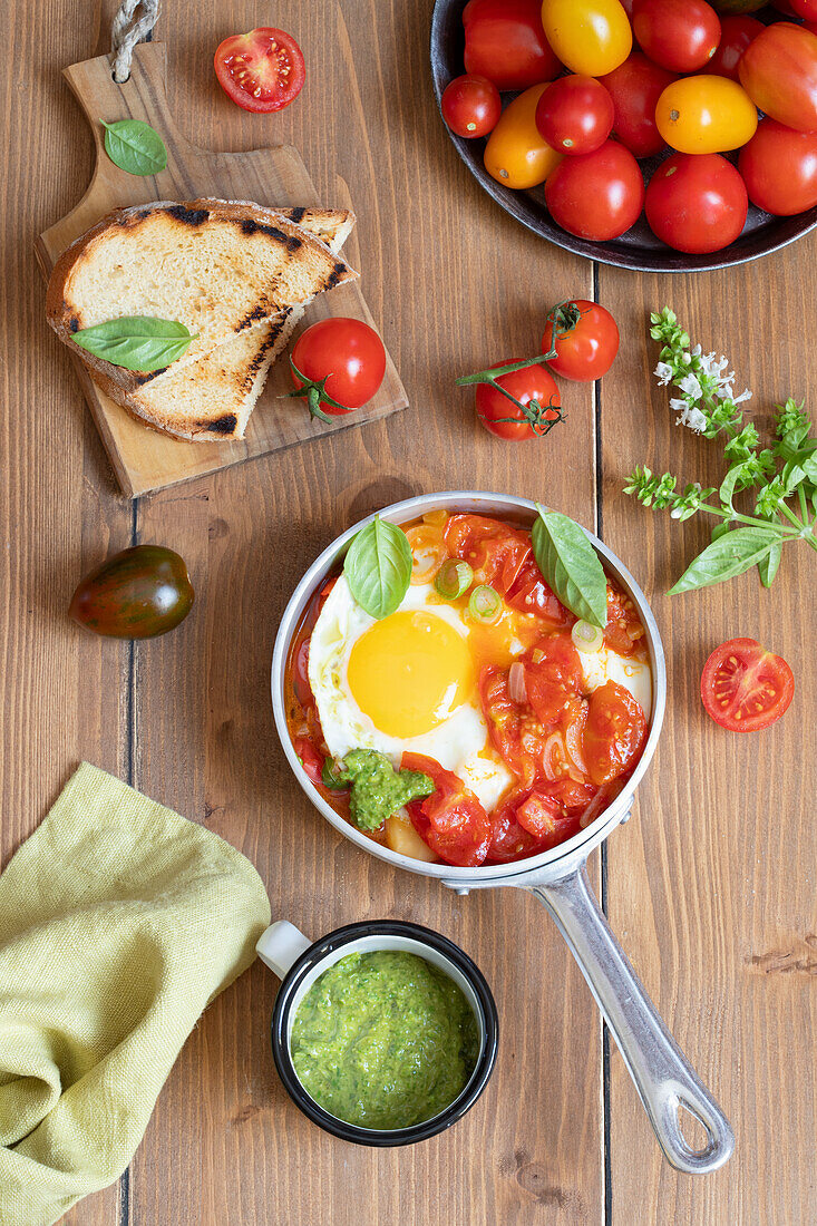 Fried egg with tomato fillet and basil pesto