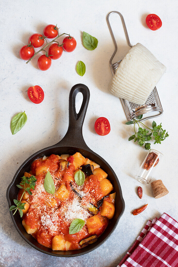 Potato gnocchi with tomatoes, eggplant, and scamorza
