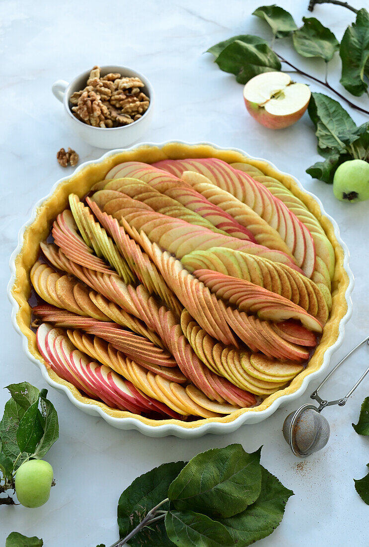 Apple tart with caramel and walnuts (unbaked)