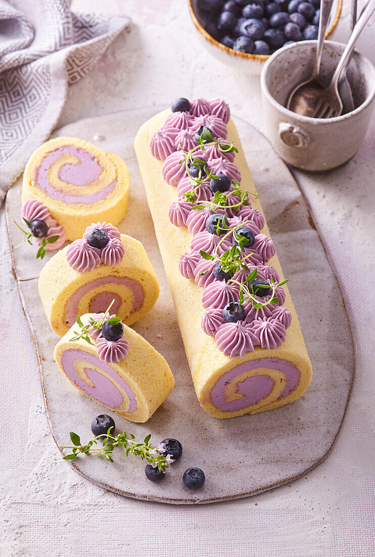 Sponge cake roll with blueberry cream and thyme
