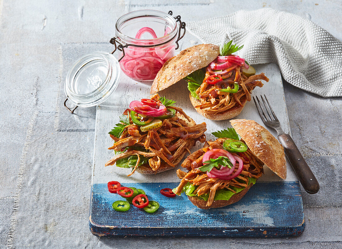 Pulled pork and pickled onions sandwiches on rolls