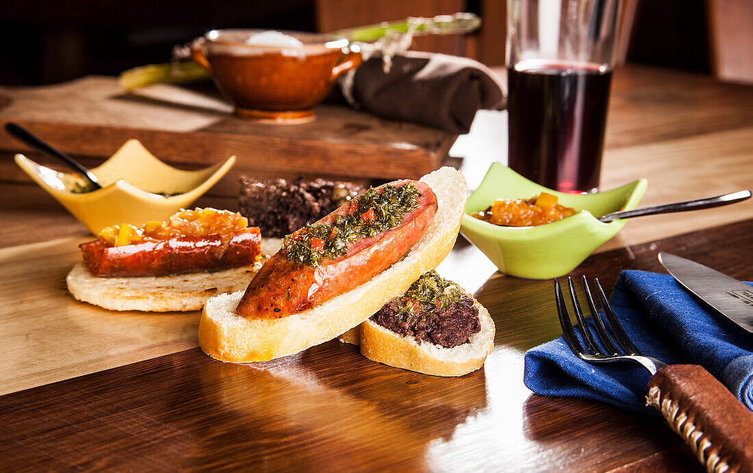 Chorizo and black pudding served on bread and arepa