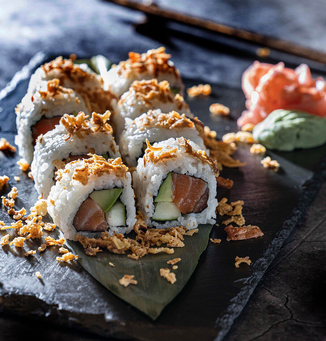 Maki sushi with tuna, cucumber, and avocado