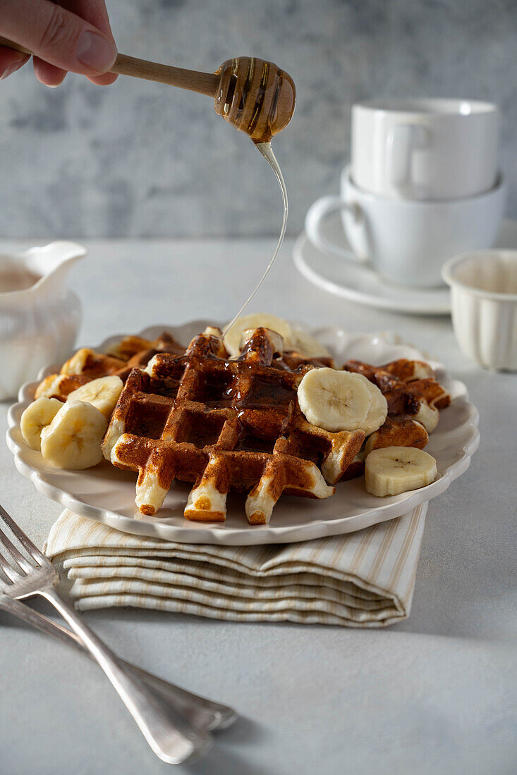 Vanilla waffles with bananas and honey