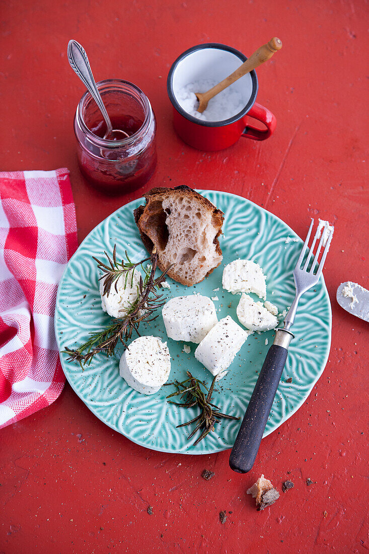 Bread, fresh goat cheese, rosemary and compote of cornel cherries