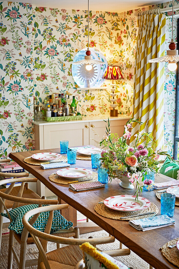 Dining area with flowered wallpaper