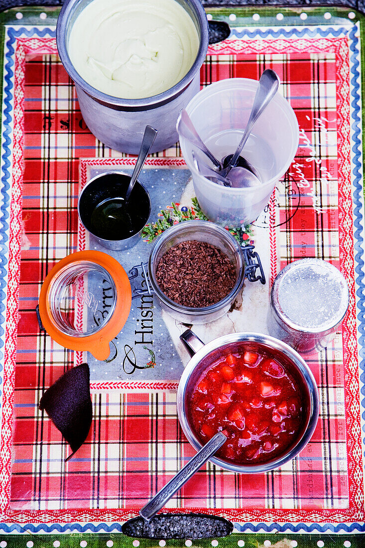 Dessert ingredients: Basil ice cream, strawberry compote, icing sugar and chocolate sprinkles