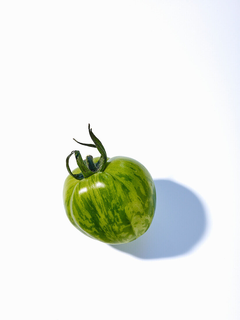 A Green Tomato on a Dish Cloth