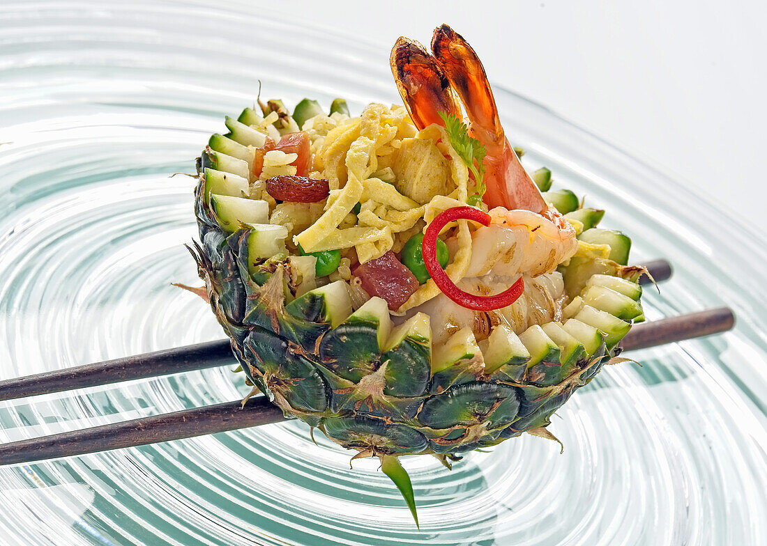 Seafood and shrimp salad in hollowed pineapple