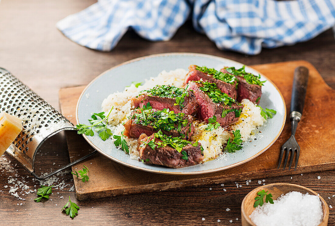Herbed beef steak with risotto