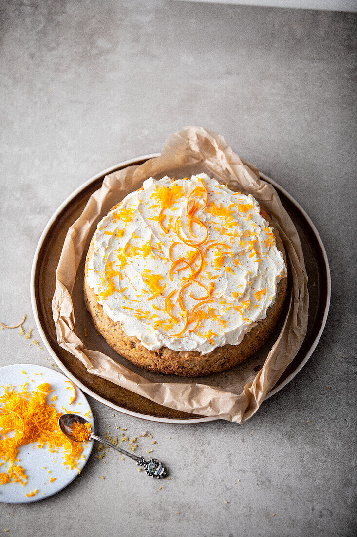 Parsnip and nut cake with orange cream cheese topping