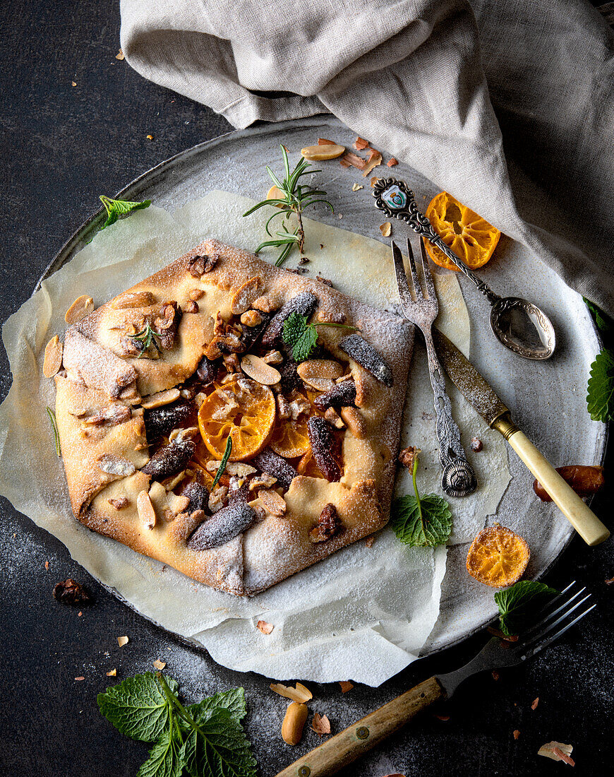 Tangerine galette with dates, nuts and herbs