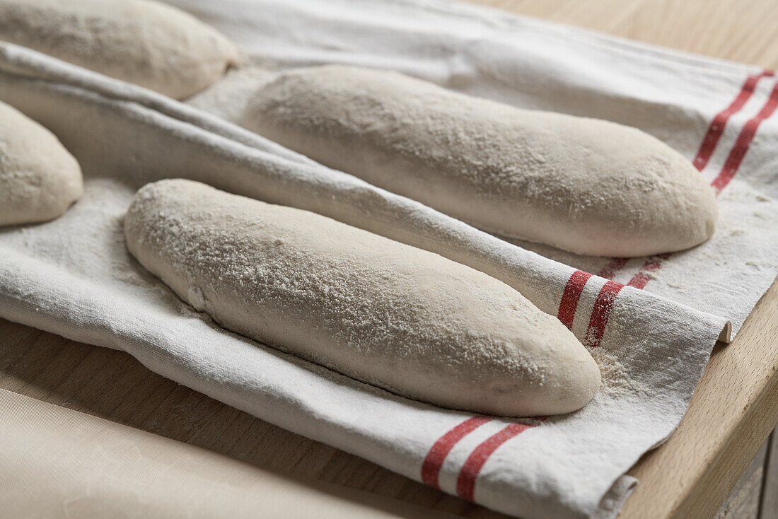 Dough loaves on linen cloth
