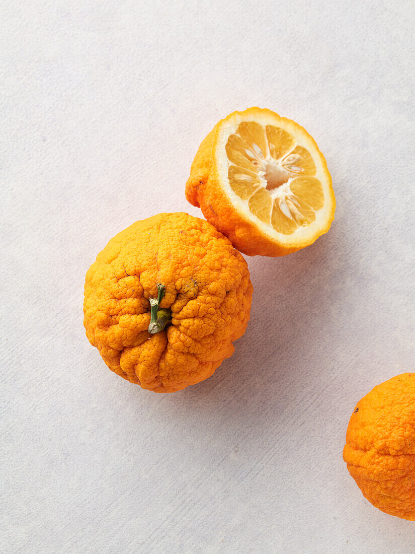 Bitter oranges, whole and halved