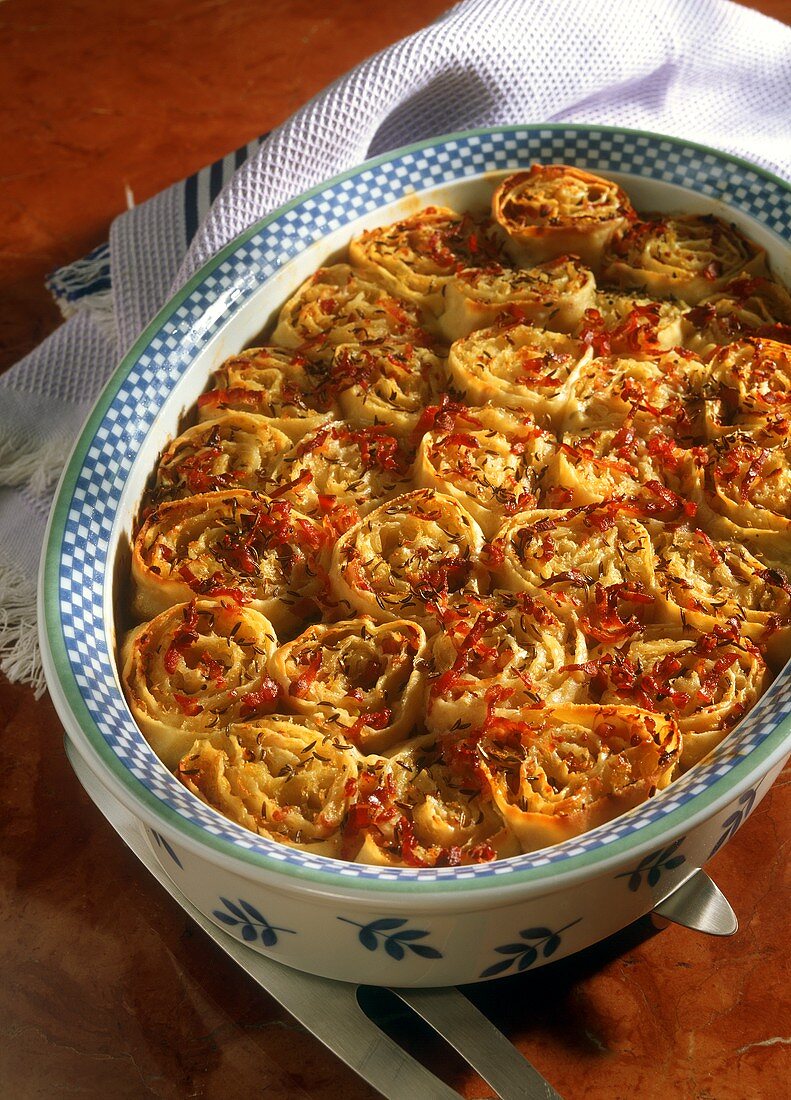 Cabbage fritters (pastry rolls with sauerkraut) in baking dish