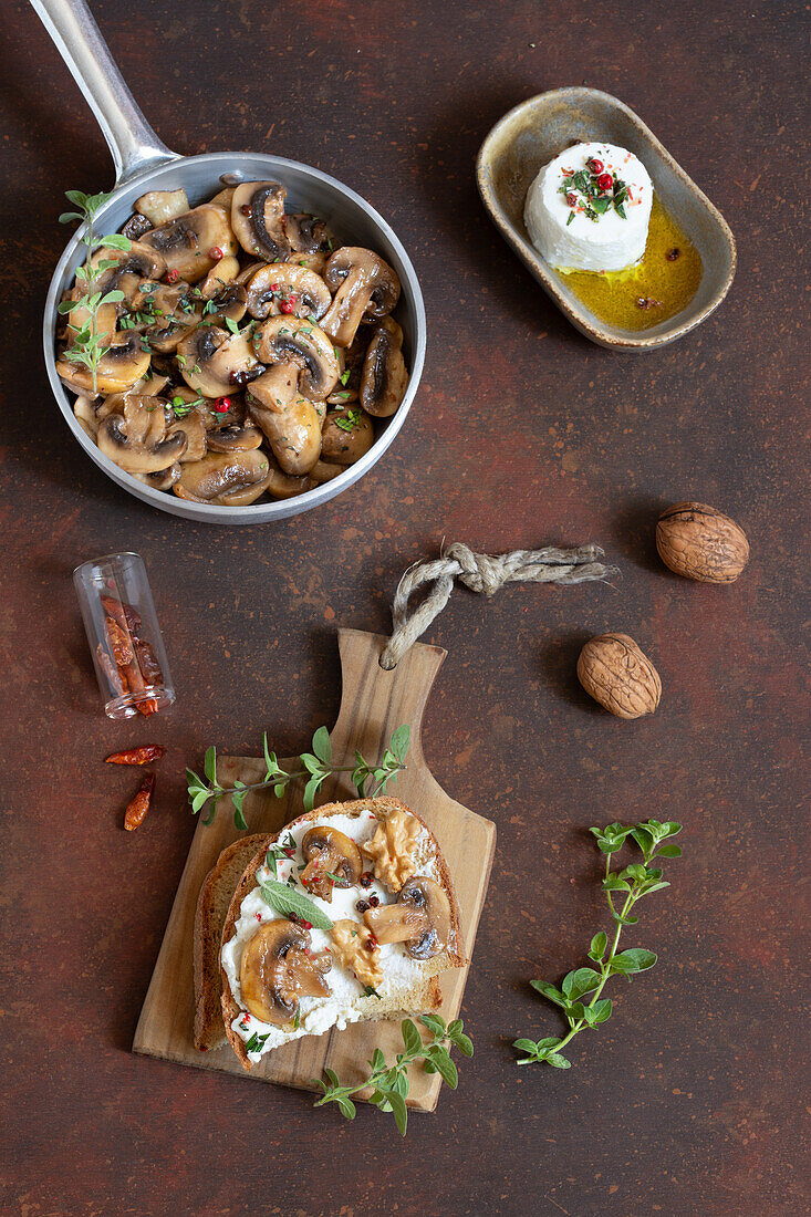 Bread topped with fresh cremini mushrooms and walnuts