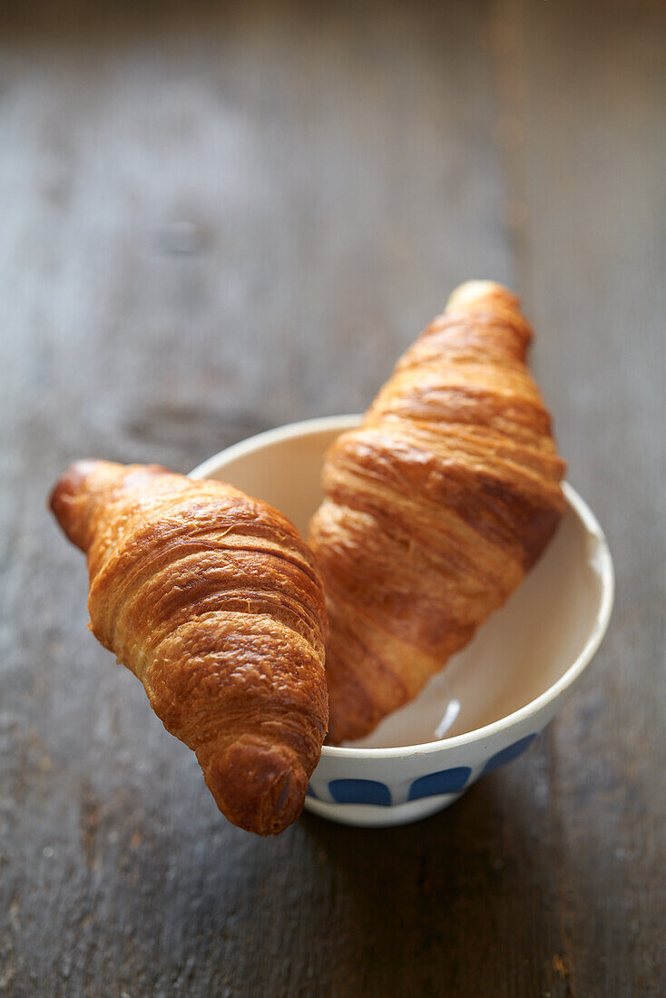 Two croissants on paper