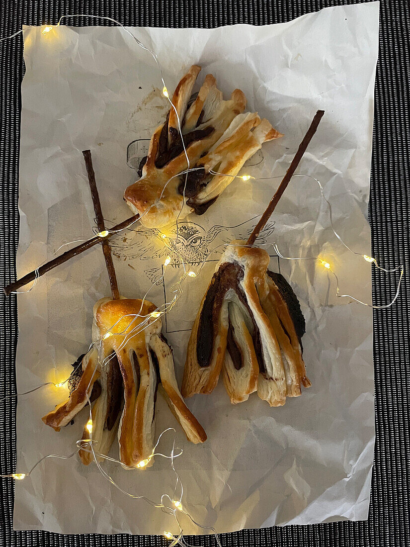 Chocolate brooms made from puff pastry for Halloween