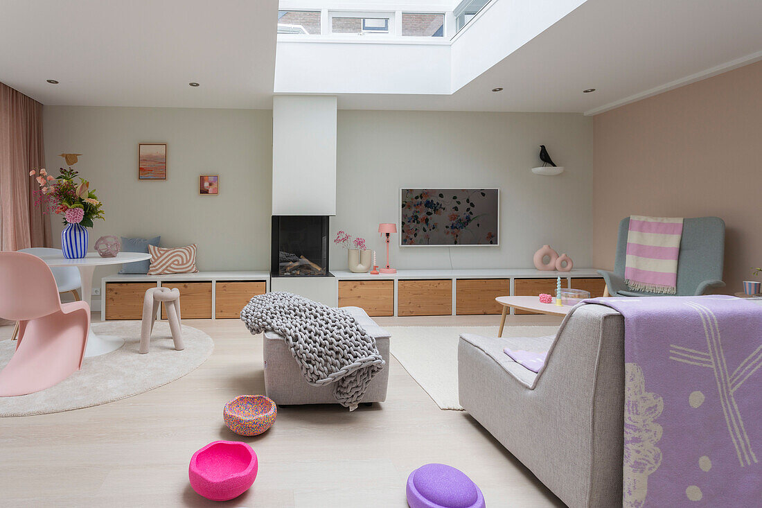 Living room with skylight, Scandinavian design and pastel-colored accents