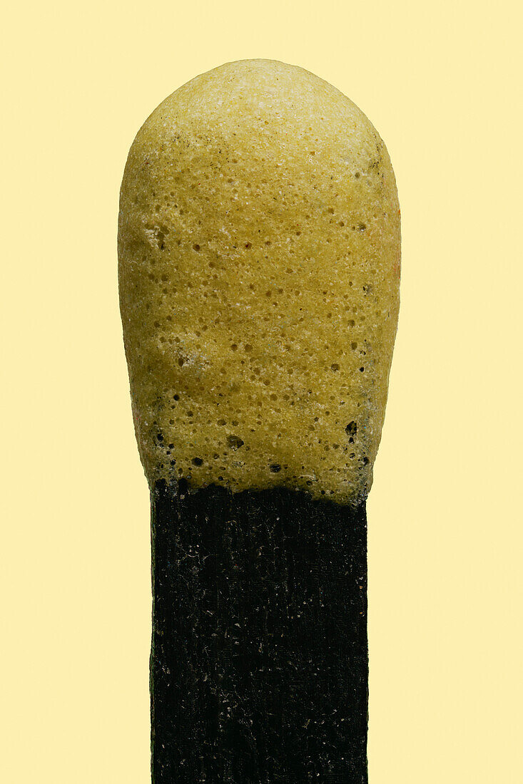 Close up still life yellow matchstick on yellow background\n
