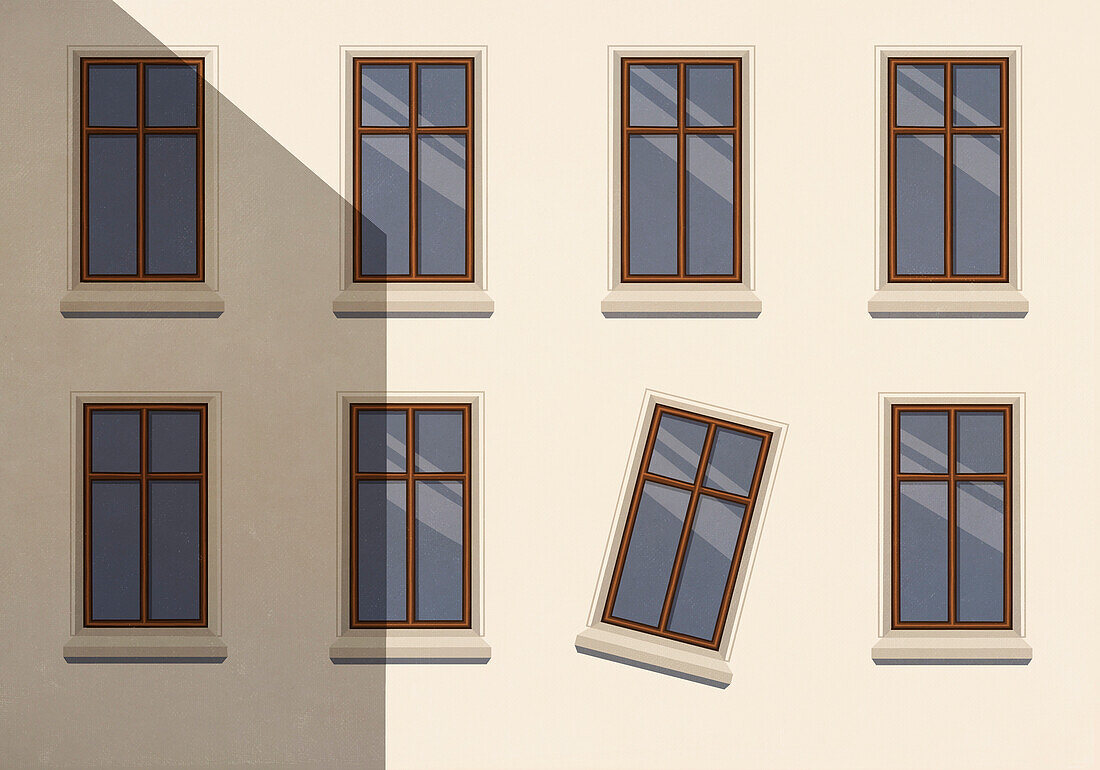 Tilted window on sunny building wall\n